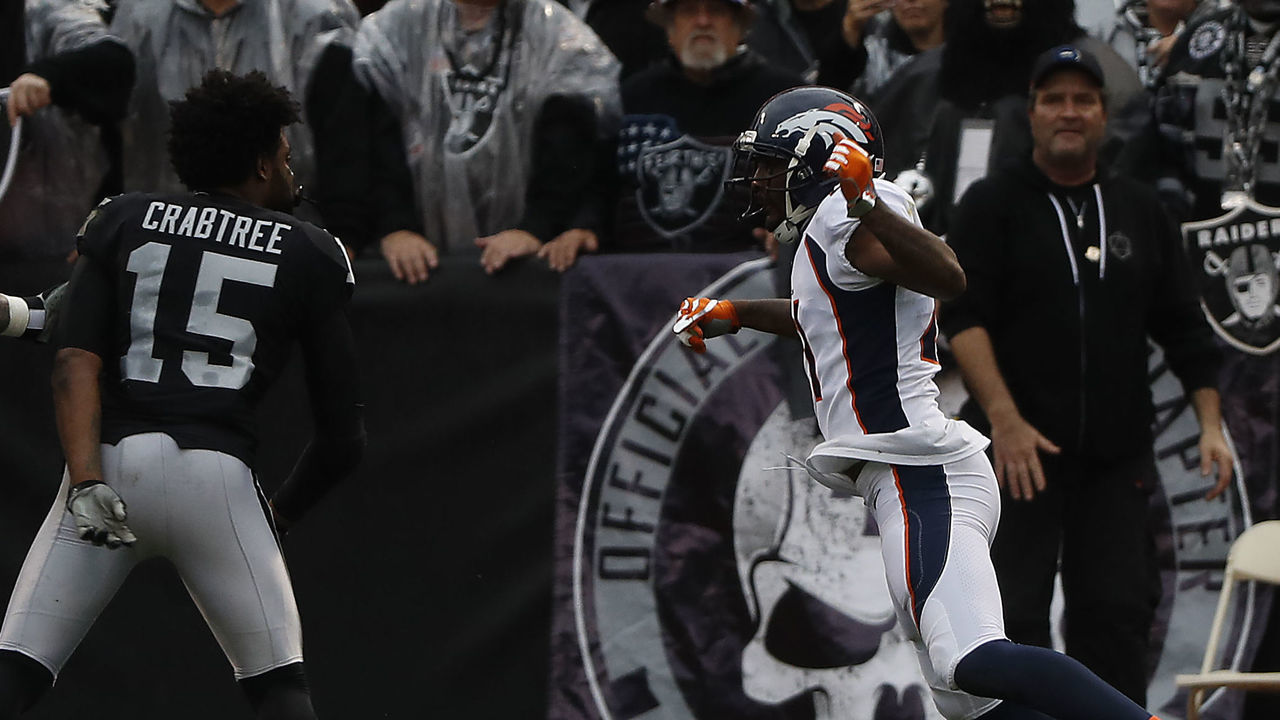 OAKLAND, CA - NOVEMBER 26: Michael Crabtree #15 of the Oakland Raiders fights with Aqib Talib #21 of the Denver Broncos during the first quarter their NFL football game at Oakland-Alameda County Coliseum on November 26, 2017 in Oakland, California. Both Crabtree and Talib were disqualified after the incident