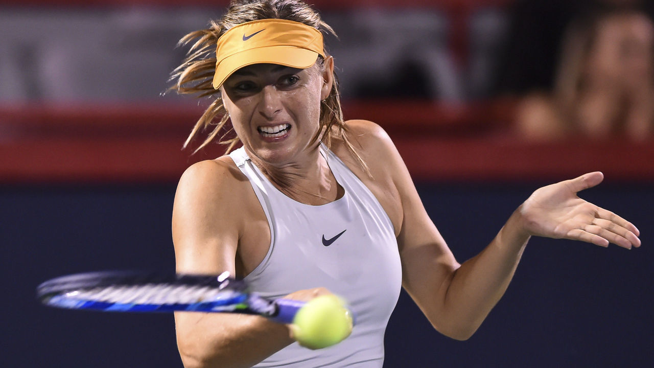 MONTREAL, QC - AUGUST 06: Maria Sharapova of Russia hits a return against Sesil Karatantcheva of Bulgaria during day one of the Rogers Cup at IGA Stadium on August 6, 2018 in Montreal, Quebec, Canada.