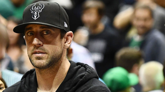MILWAUKEE, WI - APRIL 20: Quarterback Aaron Rodgers of the Green Bay Packers watches action during game three of round one of the Eastern Conference playoffs between the Milwaukee Bucks and the Boston Celtics at the Bradley Center on April 20, 2018 in Milwaukee, Wisconsin.