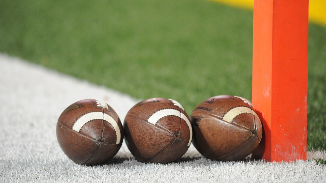 COLLEGE PARK, MD - NOVEMBER 15: Footballs sit lined up on the field before a college football game between the Michigan State Spartans and the Maryland Terrapins at Byrd Stadium on November 15, 2014 in College Park, Maryland.
