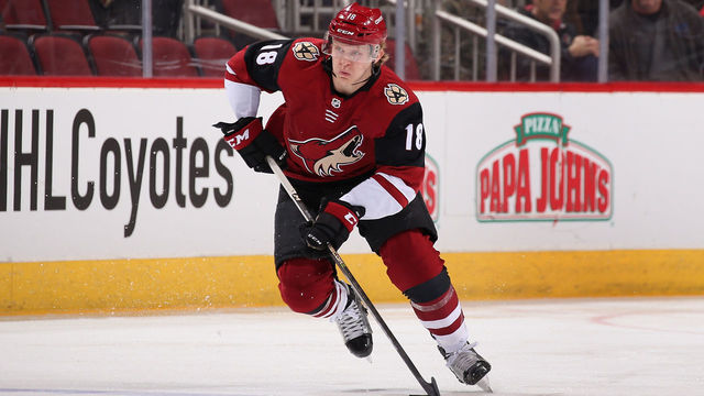 GLENDALE, AZ - JANUARY 16: Christian Dvorak #18 of the Arizona Coyotes skates with the puck during the NHL game against the San Jose Sharks at Gila River Arena on January 16, 2018 in Glendale, Arizona. The Sharks defeated the Coyotes 3-2 in an overtime shootout.