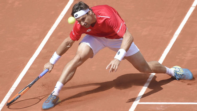 Spain's David Ferrer returns the ball during the Davis Cup quarter-final tennis match against Germany's Philipp Kohlschreiber at the bullring of Valencia, on April 8, 2018. / AFP PHOTO / JOSE JORDAN