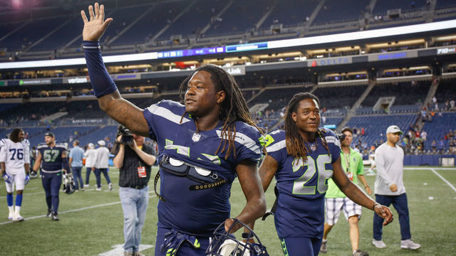 SEATTLE, WA - AUGUST 09: Linebacker Shaquem Griffin #49 (L) and brother Shaquill Griffin #26 of the Seattle Seahawks head off the field after the game against the Indianapolis Colts at CenturyLink Field on August 9, 2018 in Seattle, Washington.