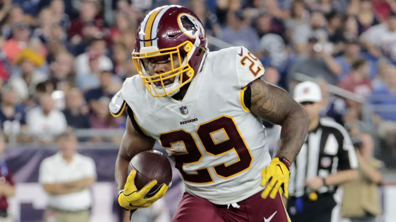 FOXBOROUGH, MA - AUGUST 09: Washington Redskins running back Derrius Guice (29) breaks through the line during a preseason NFL game between the New England Patriots and the Washington Redskins on August 9, 2018, at Gillette Stadium in Foxborough, Massachusetts. The Patriots defeated the Redskins 26-17.