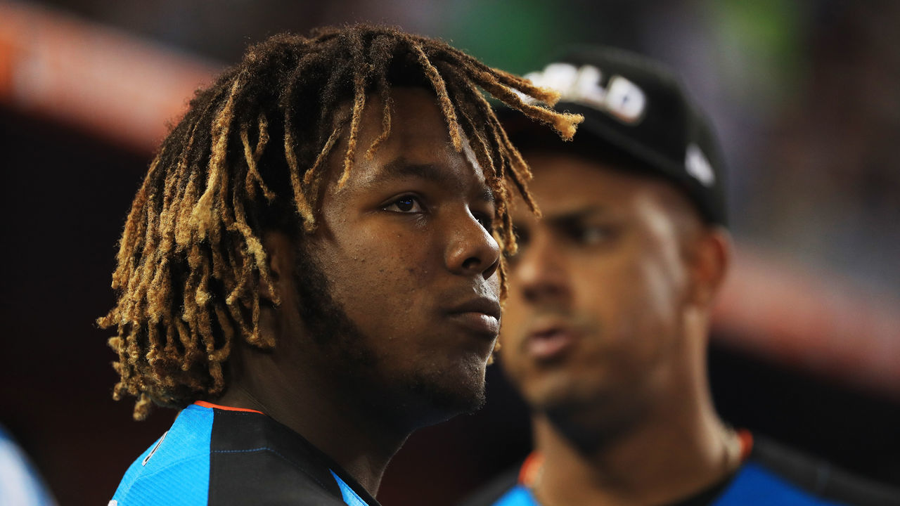 MIAMI, FL - JULY 09: Vladimir Guerrero Jr. #27 of the Toronto Blue Jays and the World Team looks on against the U.S. Team during the SiriusXM All-Star Futures Game at Marlins Park on July 9, 2017 in Miami, Florida.