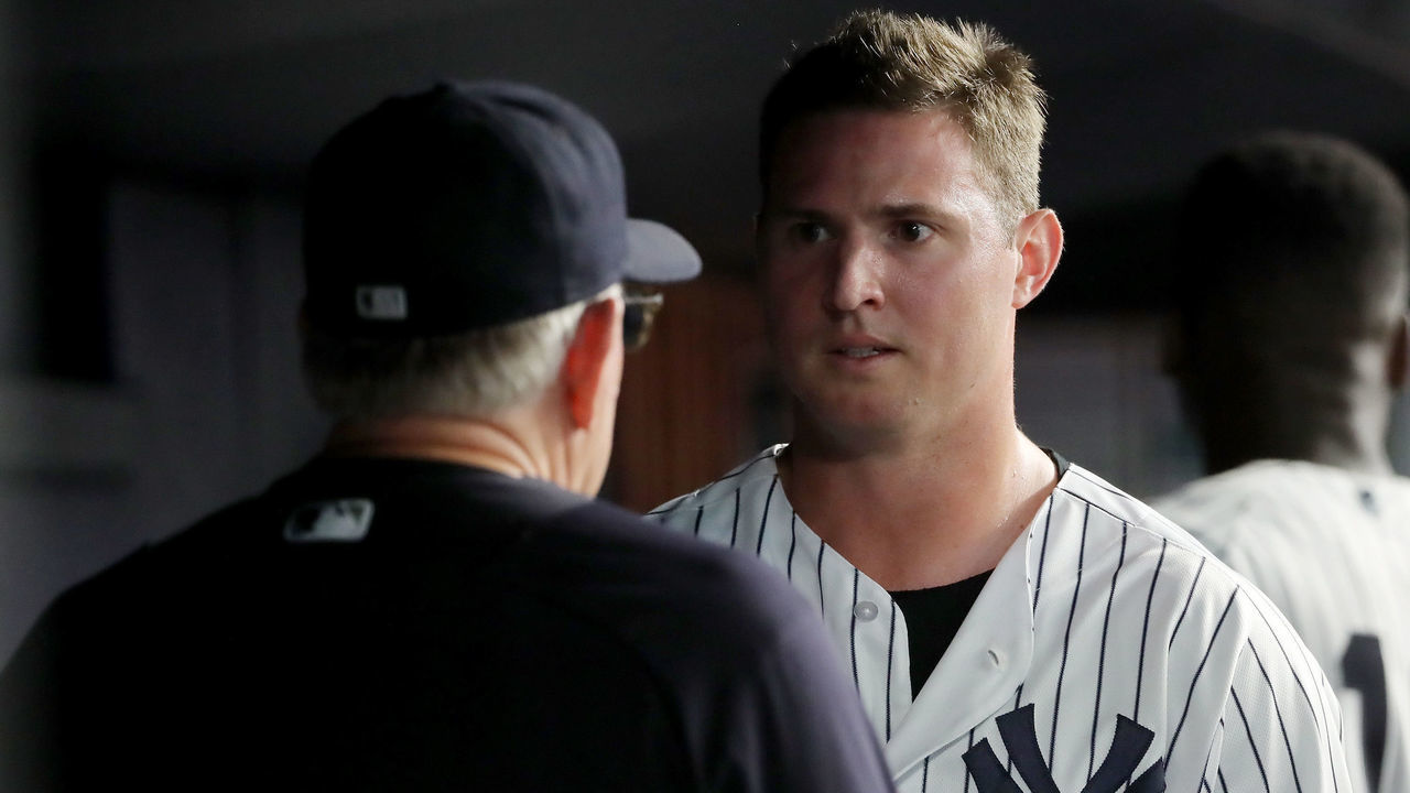 NEW YORK, NY - JULY 26: Zach Britton #53 of the New York Yankees talks with pitching coach Larry Rothschild #58 after Britton pitched in the eighth inning against the Kansas City Royals at Yankee Stadium on July 26, 2018 in the Bronx borough of New York City.