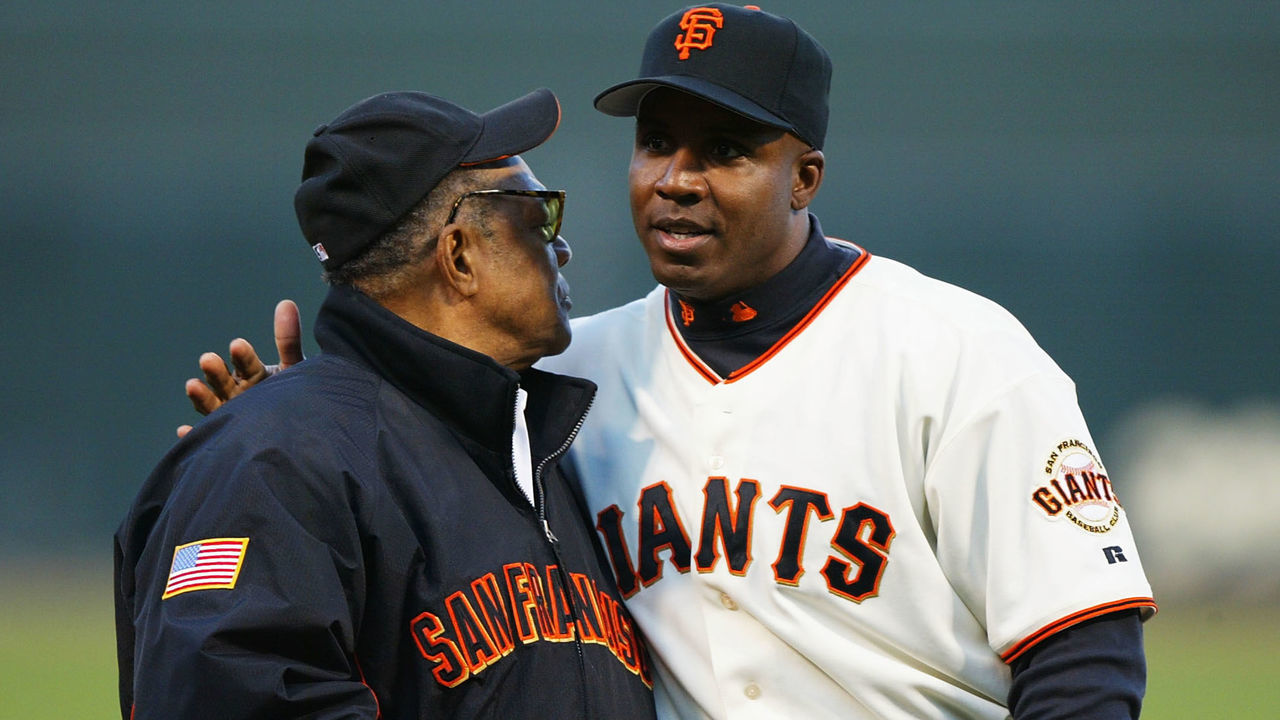 SAN FRANCISCO - APRIL 16: Barry Bonds #25 of the San Francisco Giants hugs his Godfather Willie Mays at a ceremony honoring his 660th career home run before his game against the Los Angeles Dodgers at SBC Park on April 16, 2004 in San Francisco, California.