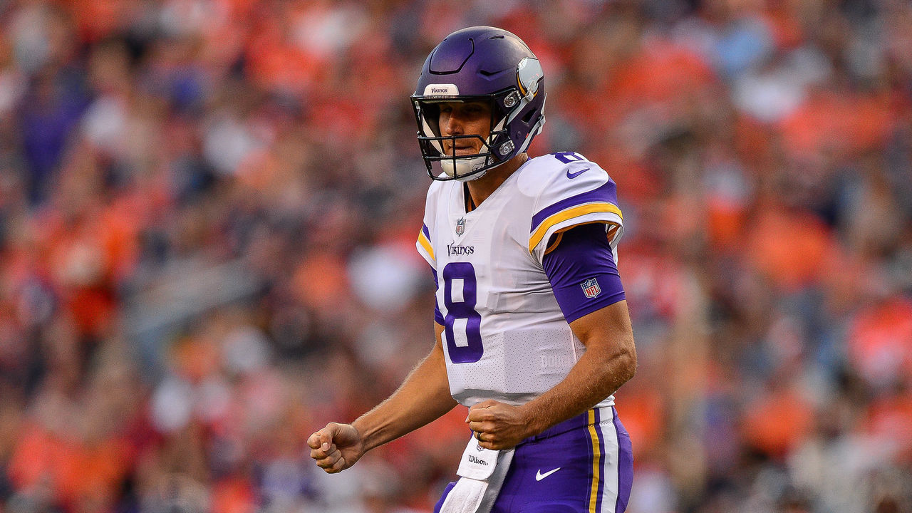 DENVER, CO - AUGUST 11: Quarterback Kirk Cousins #8 of the Minnesota Vikings celebrates after a touchdown pass to wide receiver Stefon Diggs #14 in the first quarter of a game against the Denver Broncos during an NFL preseason game at Broncos Stadium at Mile High on August 11, 2018 in Denver, Colorado.