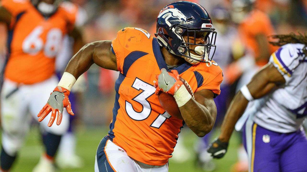 DENVER, CO - AUGUST 11: Running back Royce Freeman #37 of the Denver Broncos carries for a 23 yard second quarter touchdown against the Minnesota Vikings during an NFL preseason game at Broncos Stadium at Mile High on August 11, 2018 in Denver, Colorado.