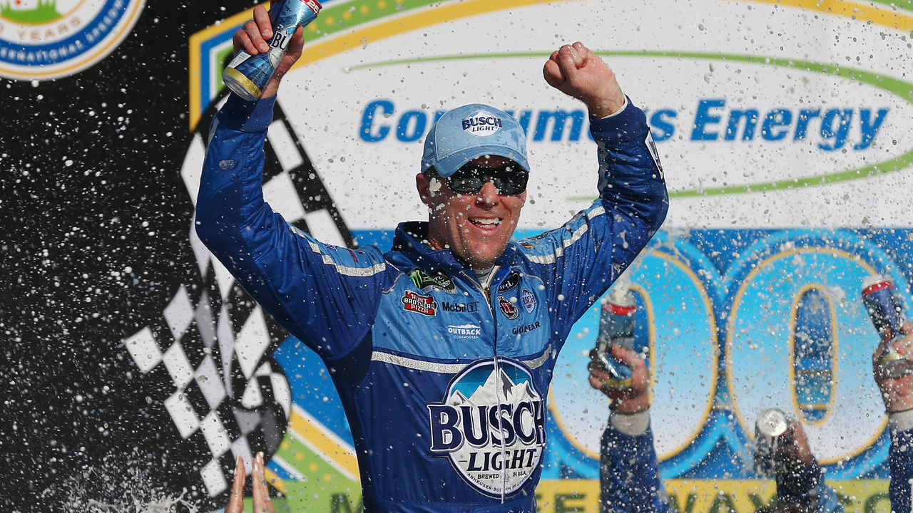 BROOKLYN, MI - AUGUST 12: Kevin Harvick, driver of the #4 Busch Light/Mobil 1 Ford, celebrates in Victory Lane after winning the Monster Energy NASCAR Cup Series Consmers Energy 400 at Michigan International Speedway on August 12, 2018 in Brooklyn, Michigan.