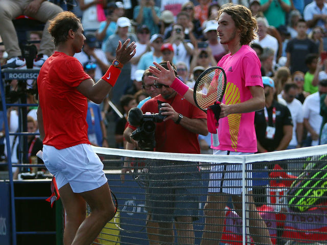 TORONTO, ON - AUGUST 12: Rafael Nadal of Spain is congratulated by Stefanos Tsitsipas of Greece following the final match on Day 7 of the Rogers Cup at Aviva Centre on August 12, 2018 in Toronto, Canada.