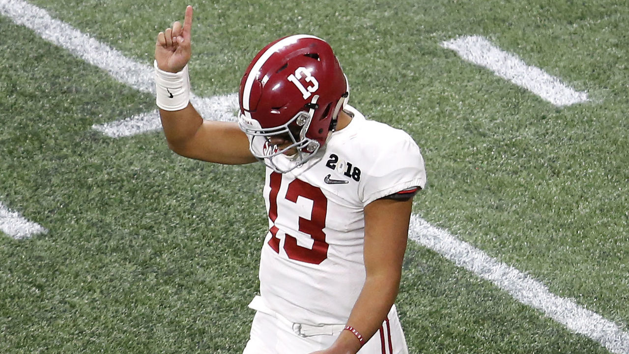 ATLANTA, GA - JANUARY 08: Quarterback Tua Tagovailoa #13 of the Alabama Crimson Tide reacts after throwing a touchdown pass in the second half during the College Football Playoff National Championship game against the Georgia Bulldogs at Mercedes-Benz Stadium on January 8, 2018 in Atlanta, Georgia.