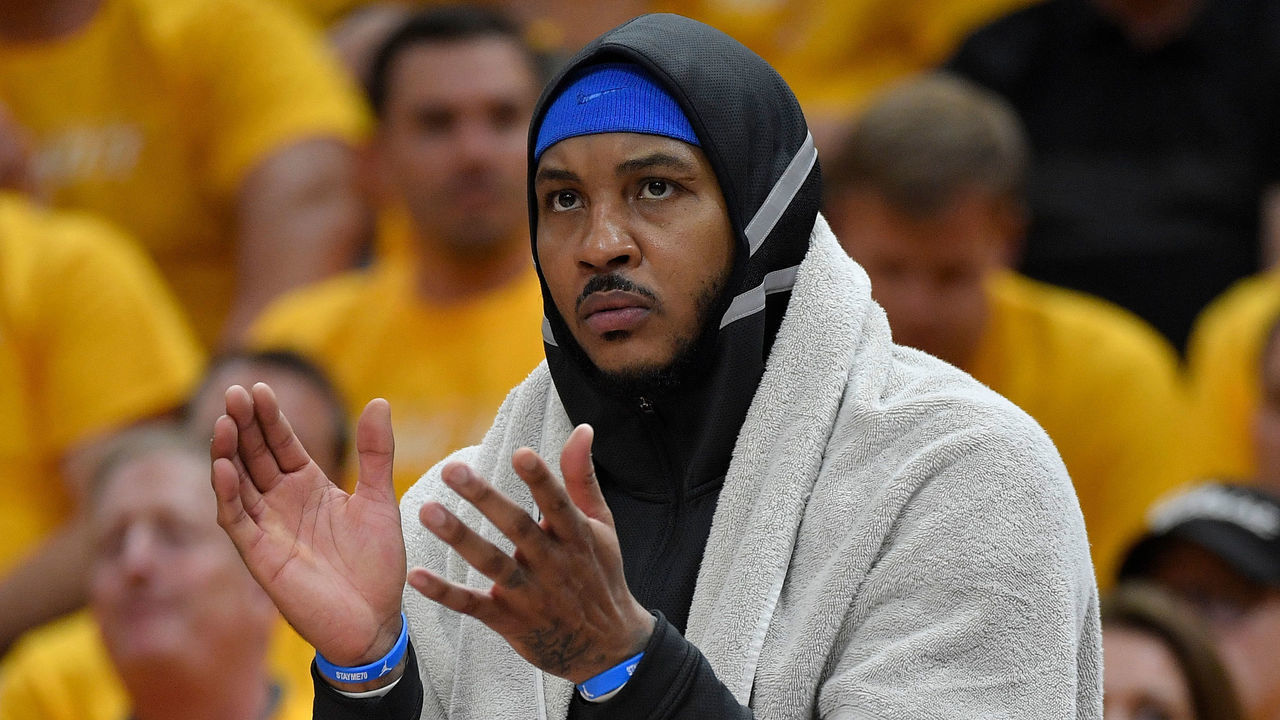 SALT LAKE CITY, UT - APRIL 21: Carmelo Anthony #7 of the Oklahoma City Thunder cheers from the bench in the first half during Game Three of Round One of the 2018 NBA Playoffs against the Utah Jazz at Vivint Smart Home Arena on April 21, 2018 in Salt Lake City, Utah.