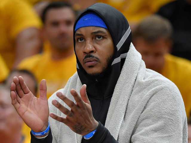 SALT LAKE CITY, UT - APRIL 21: Carmelo Anthony #7 of the Oklahoma City Thunder cheers from the bench in the first half during Game Three of Round One of the 2018 NBA Playoffs against the Utah Jazz at Vivint Smart Home Arena on April 21, 2018 in Salt Lake City, Utah.
