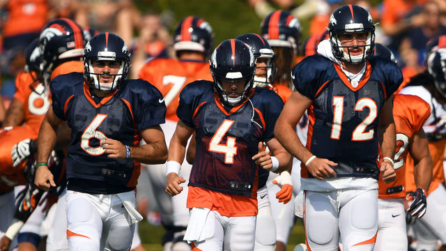 ENGLEWOOD, CO - AUGUST 7: Quarterback's Chad Kelly #6, Case Keenum #4 and Paxton Lynch #12 of the Denver Broncos heading to their section of the field for drills during training camp at the UCHealth Training Center August 7, 2018 in Englewood, Colorado.