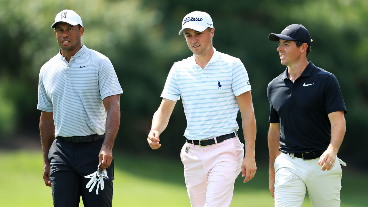 ST LOUIS, MO - AUGUST 10: (L-R) Tiger Woods of the United States, Justin Thomas of the United States and Rory McIlroy of Northern Ireland walk on the eighth hole during the second round of the 2018 PGA Championship at Bellerive Country Club on August 10, 2018 in St Louis, Missouri.