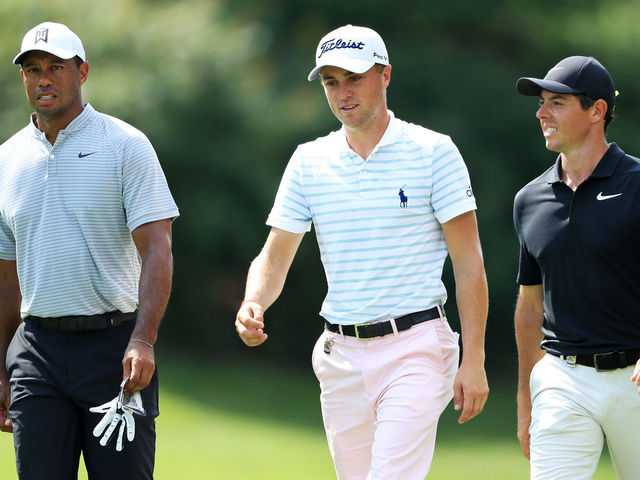 ST LOUIS, MO - AUGUST 10: (L-R) Tiger Woods of the United States, Justin Thomas of the United States and Rory McIlroy of Northern Ireland walk on the eighth hole during the second round of the 2018 PGA Championship at Bellerive Country Club on August 10, 2018 in St Louis, Missouri.