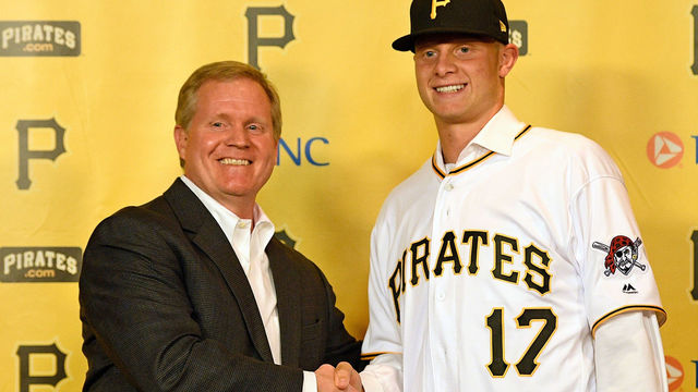 PITTSBURGH, PA - JUNE 16: Pittsburgh Pirates General Manager Neil Huntington shakes hands with 2017 First Round Draft Pick Shane Baz at a press conference to announcing his signing at PNC Park on June 16, 2017 in Pittsburgh, Pennsylvania.