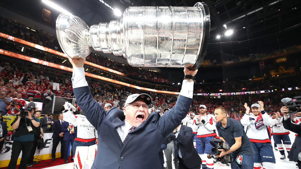LAS VEGAS, NV - JUNE 07: Head coach Barry Trotz of the Washington Capitals hoists the Stanley Cup after his team defeated the Vegas Golden Knights 4-3 in Game Five of the 2018 NHL Stanley Cup Final at T-Mobile Arena on June 7, 2018 in Las Vegas, Nevada.