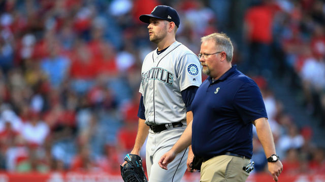 ANAHEIM, CA - JULY 12: James Paxton #65 of the Seattle Mariners leaves the game after allowing two homeruns during the first inning of a game against the Los Angeles Angels of Anaheim at Angel Stadium on July 12, 2018 in Anaheim, California.