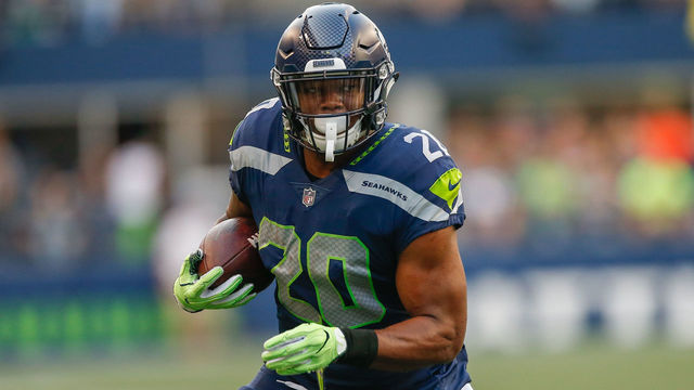 SEATTLE, WA - AUGUST 09: Running back Rashaad Penny #20 of the Seattle Seahawks rushes against the Indianapolis Colts at CenturyLink Field on August 9, 2018 in Seattle, Washington.