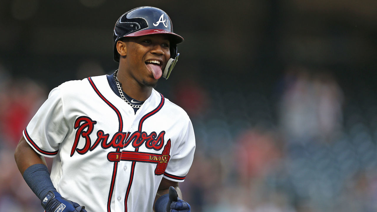 ATLANTA, GA - AUGUST 14: Ronald Acuna, Jr. #13 of the Atlanta Braves sticks out his tongue after hitting a leadoff home run in the first inning against the Miami Marlins at SunTrust Park on August 14, 2018 in Atlanta, Georgia.