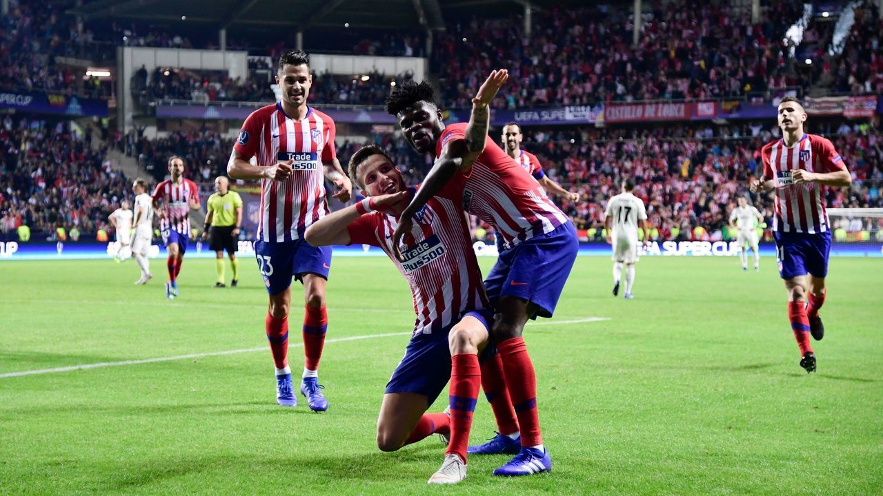 Atletico Madrid's Spanish midfielder Saul Niguez (C) celebrates with teammates after scoring a goal during the UEFA Super Cup football match between Real Madrid and Atletico Madrid at the Lillekula Stadium in the Estonian capital Tallinn on August 15, 2018.
