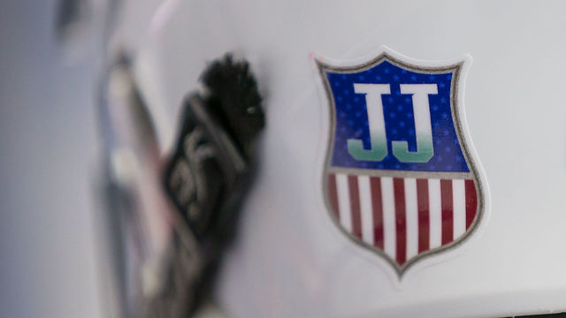 PLYMOUTH, MI - FEBRUARY 14: The helmet of Bode Wilde #15 and the rest of the USA Nationals have a sticker 'JJ' in honor of Jim Johannson, assistant executive director of USA Hockey and the general manager of the 2018 U.S. Olympic men'u2019s ice hockey team who recently passed away at his home in Colorado during the 2018 Under-18 Five Nations Tournament game against the Czech Nationals at USA Hockey Arena on February 14, 2018 in Plymouth, Michigan. The Czech Republic defeated the USA Nationals 6-2. *** Local Caption *** Bode Wilde