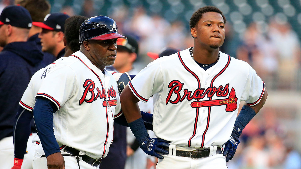ATLANTA, GA - AUGUST 15: Ronald Acuna Jr. #13 (R) of the Atlanta Braves reacts to being hit by the first pitch of the game against the Miami Marlins at SunTrust Park on August 15, 2018 in Atlanta, Georgia.