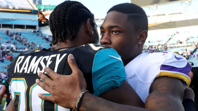 JACKSONVILLE, FL - DECEMBER 11: Jalen Ramsey #20 of the Jacksonville Jaguars and Stefon Diggs of the Minnesota Vikings embrace after the game at EverBank Field on December 11, 2016 in Jacksonville, Florida.