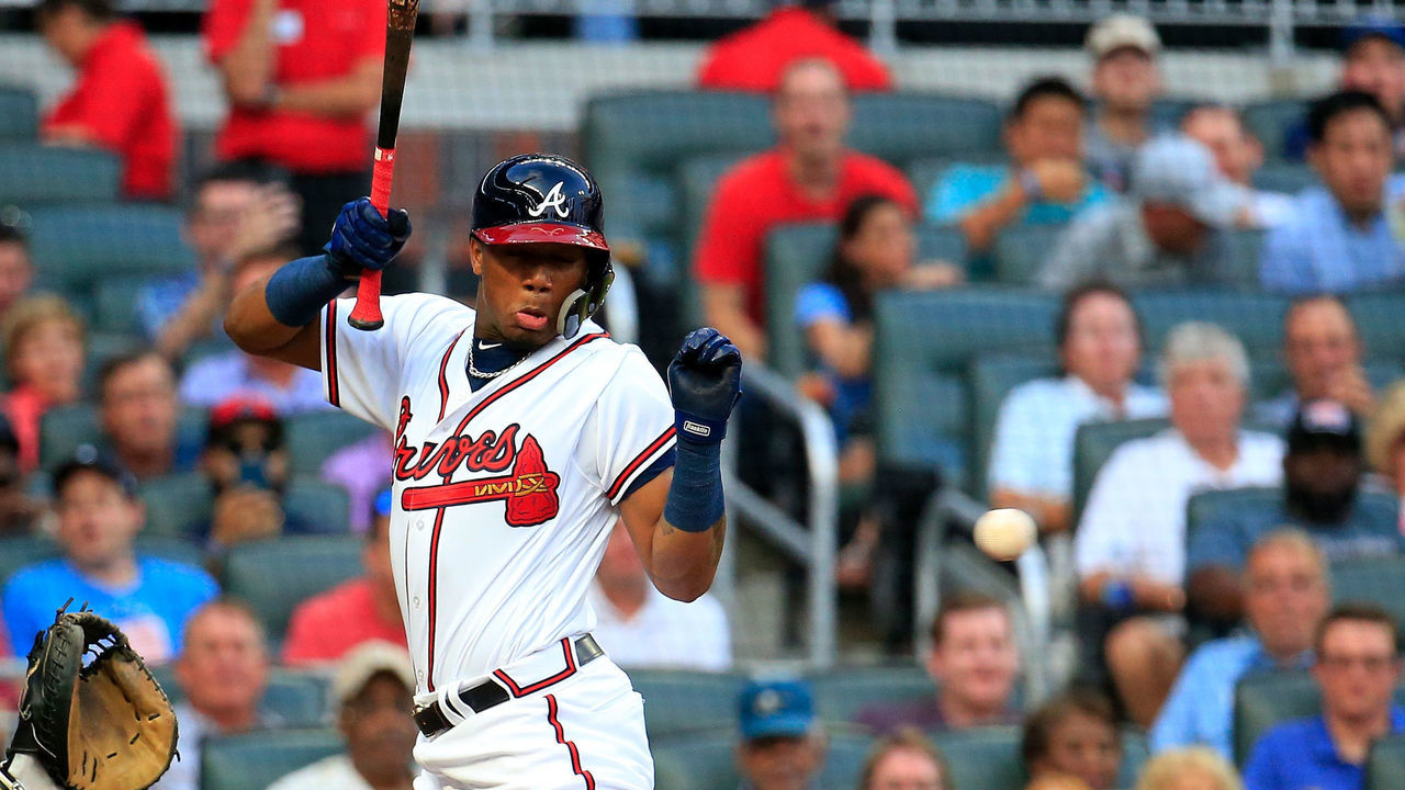 ATLANTA, GA - AUGUST 15: Ronald Acuna Jr. #13 of the Atlanta Braves is hit by the first pitch of the game against the Miami Marlins at SunTrust Park on August 15, 2018 in Atlanta, Georgia.