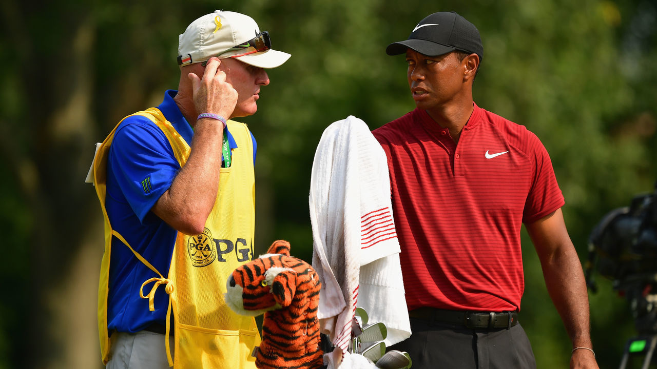 ST LOUIS, MO - AUGUST 12: Tiger Woods of the United States talks with caddie Joe LaCava on the 13th tee during the final round of the 2018 PGA Championship at Bellerive Country Club on August 12, 2018 in St Louis, Missouri.