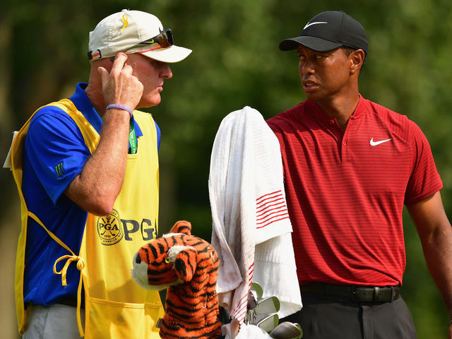 ST LOUIS, MO - AUGUST 12: Tiger Woods of the United States talks with caddie Joe LaCava on the 13th tee during the final round of the 2018 PGA Championship at Bellerive Country Club on August 12, 2018 in St Louis, Missouri.