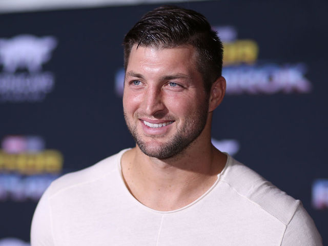 HOLLYWOOD, CA - OCTOBER 10: Professional football player Tim Tebow at The World Premiere of Marvel Studios' 'Thor: Ragnarok' at the El Capitan Theatre on October 10, 2017 in Hollywood, California.