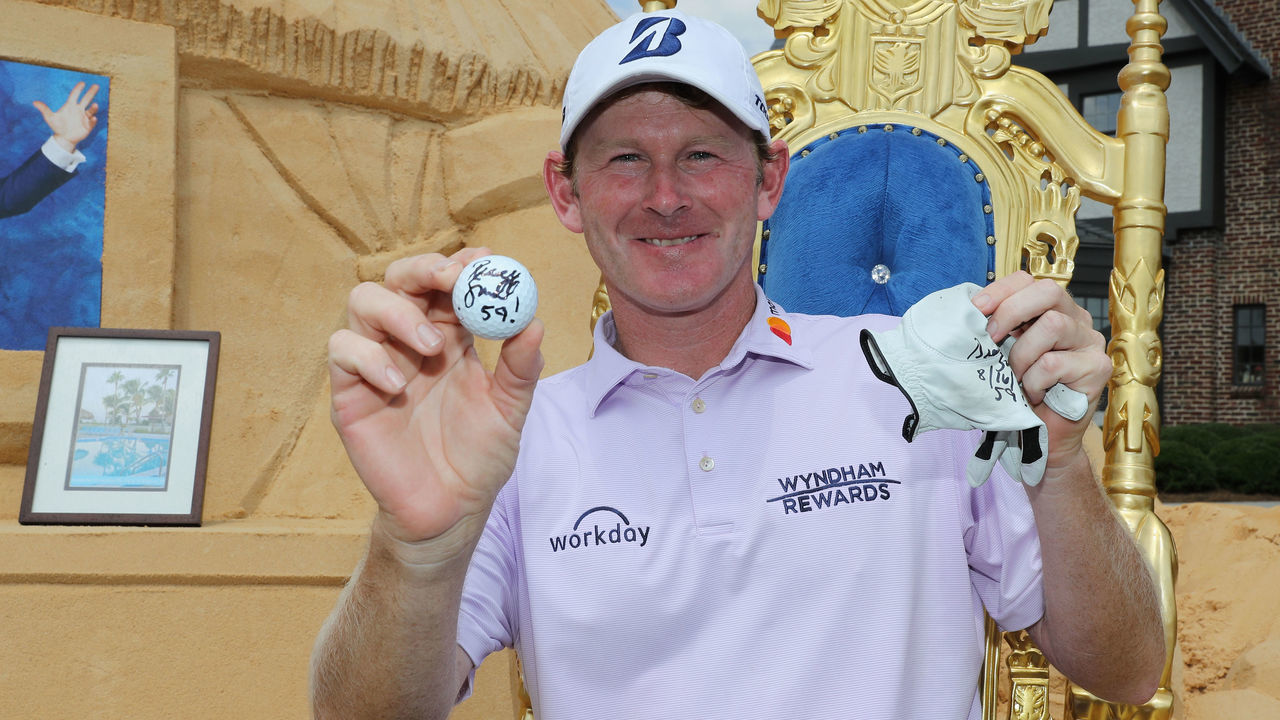 GREENSBORO, NC - AUGUST 16: Brandt Snedeker poses with the ball and glove that he shot 59 with during the first round of the Wyndham Championship at Sedgefield Country Club on August 16, 2018 in Greensboro, North Carolina.