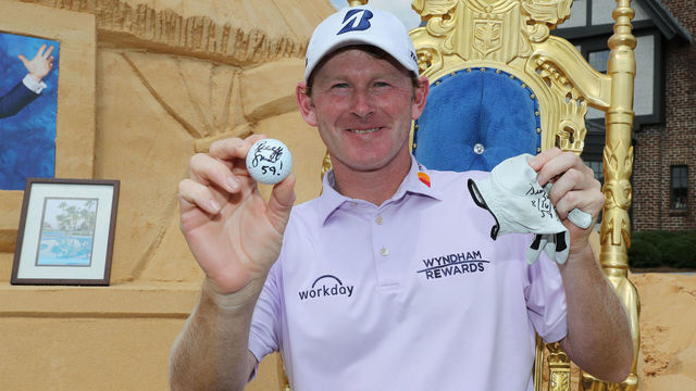 GREENSBORO, NC - AUGUST 16: Brandt Snedeker poses with the ball and glove that he shot 59 with during the first round of the Wyndham Championship at Sedgefield Country Club on August 16, 2018 in Greensboro, North Carolina.