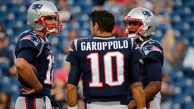 FOXBORO, MA - AUGUST 31: Jimmy Garoppolo #10, Jacoby Brissett #7 and Tom Brady #12 of the New England Patriots chat before a preseason game with the New York Giants at Gillette Stadium on August 31, 2017 in Foxboro, Massachusetts.