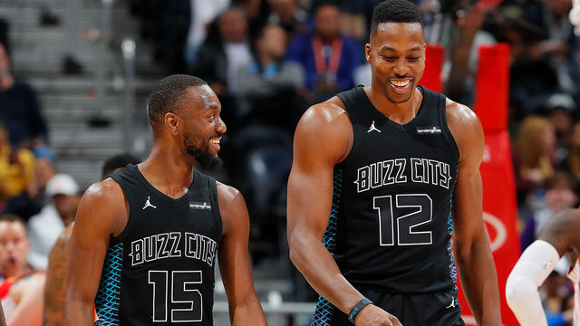 ATLANTA, GA - JANUARY 31: Dwight Howard #12 of the Charlotte Hornets reacts with Kemba Walker #15 after drawing a foul on his dunk over Mike Muscala #31 of the Atlanta Hawks at Philips Arena on January 31, 2018 in Atlanta, Georgia.