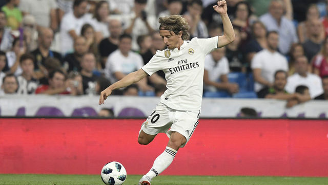 Real Madrid's Croatian midfielder Luka Modric prepares to kick the ball during the Santiago Bernabeu Trophy football match between Real Madrid and AC Milan in Madrid on August 11, 2018.