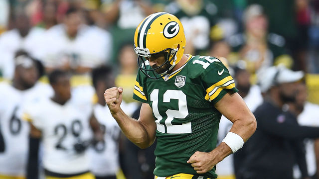 GREEN BAY, WI - AUGUST 16: Aaron Rodgers #12 of the Green Bay Packers celebrates a touchdown pass during the first quarter of a preseason game against the Pittsburgh Steelers at Lambeau Field on August 16, 2018 in Green Bay, Wisconsin.