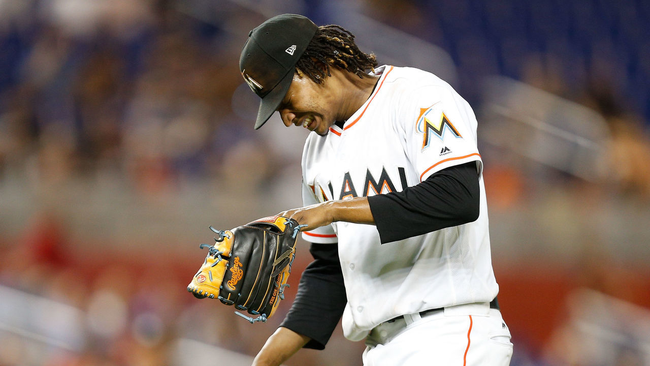 MIAMI, FL - JULY 09: Jose Urena #62 of the Miami Marlins reacts after being hit in the fourth inning against the Milwaukee Brewers at Marlins Park on July 9, 2018 in Miami, Florida.