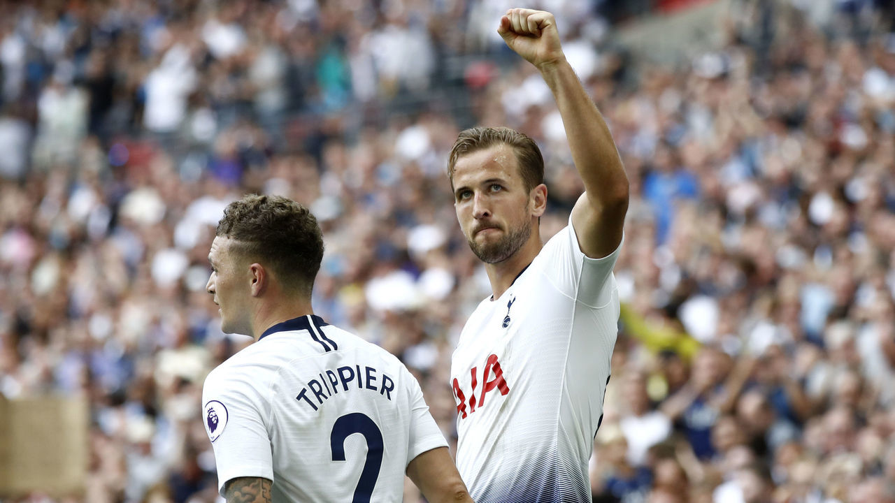 LONDON, ENGLAND - AUGUST 18: Harry Kane of Tottenham Hotspur celebrates scoring his side's third goal with Kieran Trippier during the Premier League match between Tottenham Hotspur and Fulham FC at Wembley Stadium on August 18, 2018 in London, United Kingdom.
