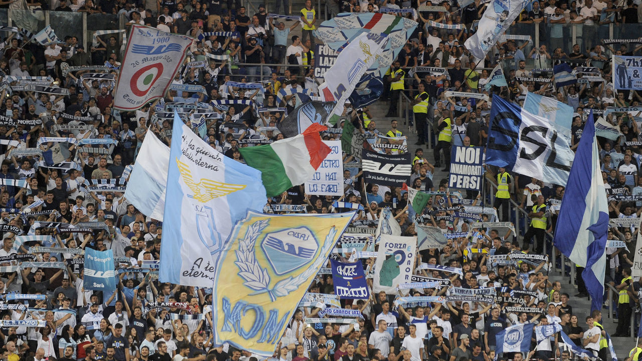 ROME, ITALY - AUGUST 18: SS Lazio fans cheer for their team during the serie A match between SS Lazio and SSC Napoli at Stadio Olimpico on August 18, 2018 in Rome, Italy.