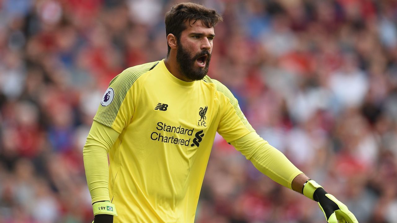 Liverpool's Brazilian goalkeeper Alisson Becker gestures during the English Premier League football match between Liverpool and West Ham United at Anfield in Liverpool, north west England on August 12, 2018.