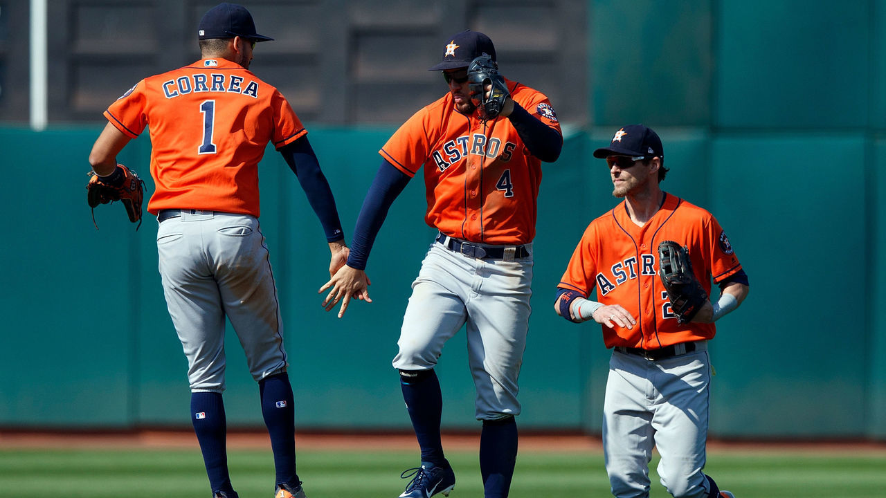 OAKLAND, CA - AUGUST 19: Carlos Correa #1 of the Houston Astros, George Springer #4 and Josh Reddick #22 celebrates after the game against the Oakland Athletics at the Oakland Coliseum on August 19, 2018 in Oakland, California. The Houston Astros defeated the Oakland Athletics 9-4.