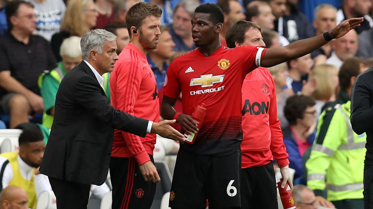 BRIGHTON, ENGLAND - AUGUST 19: Jose Mourinho, Manager of Manchester United speaks with Paul Pogba of Manchester United during the Premier League match between Brighton & Hove Albion and Manchester United at American Express Community Stadium on August 19, 2018 in Brighton, United Kingdom.