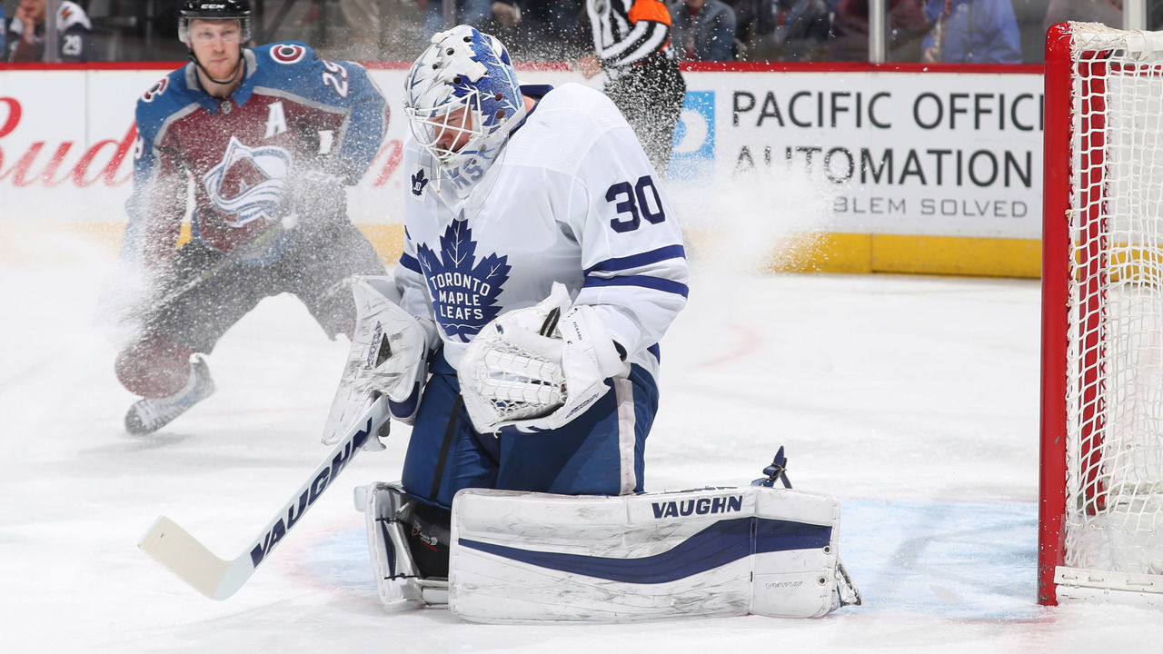 DENVER, CO - DECEMBER 29: Goaltender Calvin Pickard #30 of the Toronto Maple Leafs makes a save against Nathan MacKinnon #29 of the Colorado Avalanche at the Pepsi Center on December 29, 2017 in Denver, Colorado. The Avalanche defeated the Maple Leafs 4-3 in overtime.