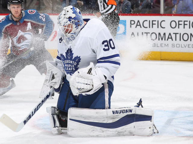 DENVER, CO - DECEMBER 29: Goaltender Calvin Pickard #30 of the Toronto Maple Leafs makes a save against Nathan MacKinnon #29 of the Colorado Avalanche at the Pepsi Center on December 29, 2017 in Denver, Colorado. The Avalanche defeated the Maple Leafs 4-3 in overtime.