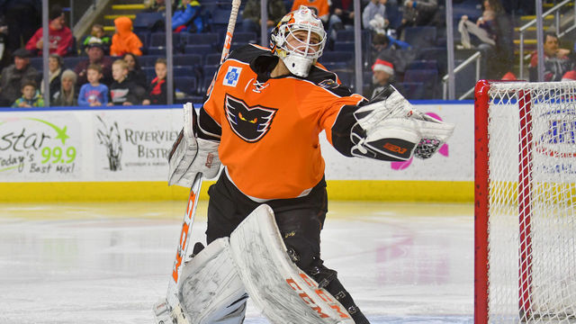 BRIDGEPORT, CT - DECEMBER 17: Dustin Tokarski #35 of the Lehigh Valley Phantoms makes a glove save during a game against the Bridgeport Sound Tigers at the Webster Bank Arena on December 17, 2017 in Bridgeport, Connecticut.