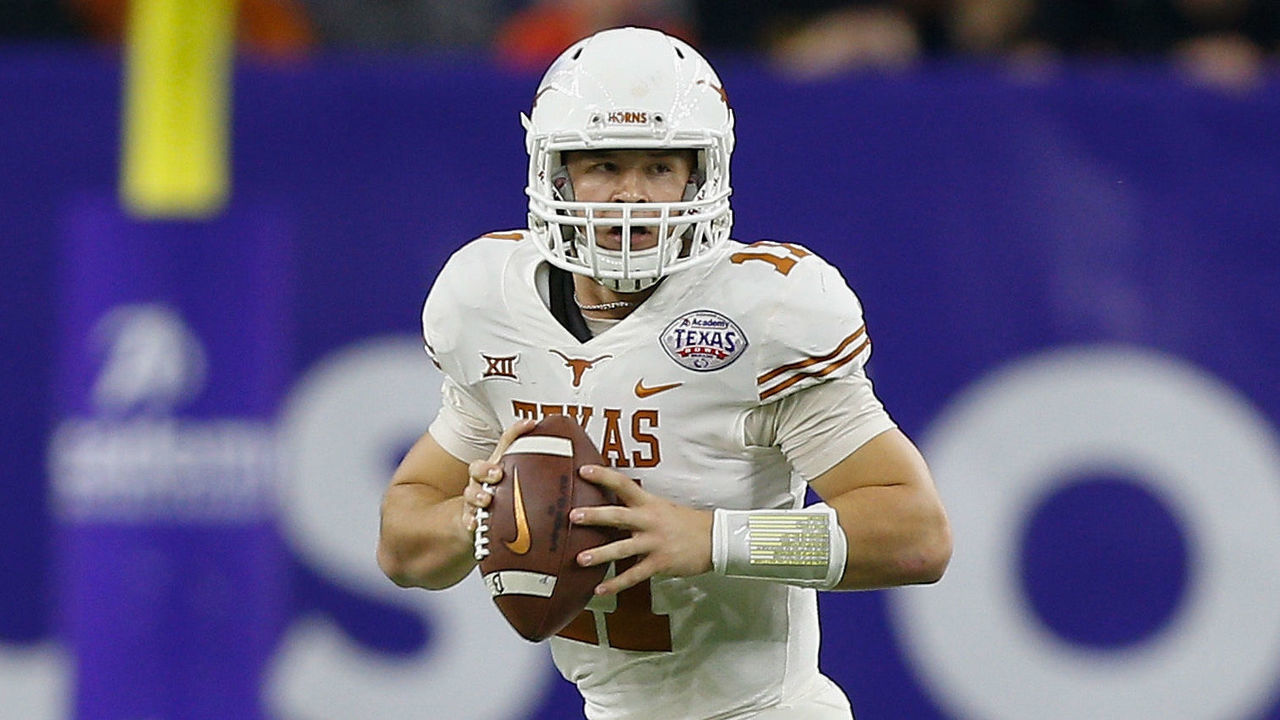 HOUSTON, TX - DECEMBER 27: Sam Ehlinger #11 of the Texas Longhorns rolls out of the pocket looking for a receiver against the Missouri Tigers at NRG Stadium on December 27, 2017 in Houston, Texas.